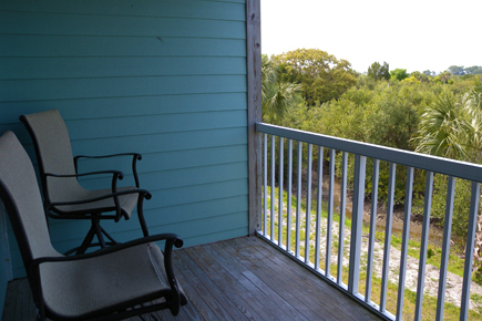 balcony with chairs overlooking the wetlands