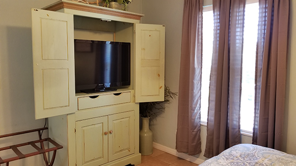 TV armoire in bedroom