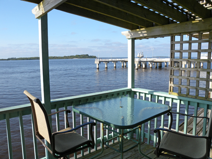 the private balcony with the fishing pier in the distance.